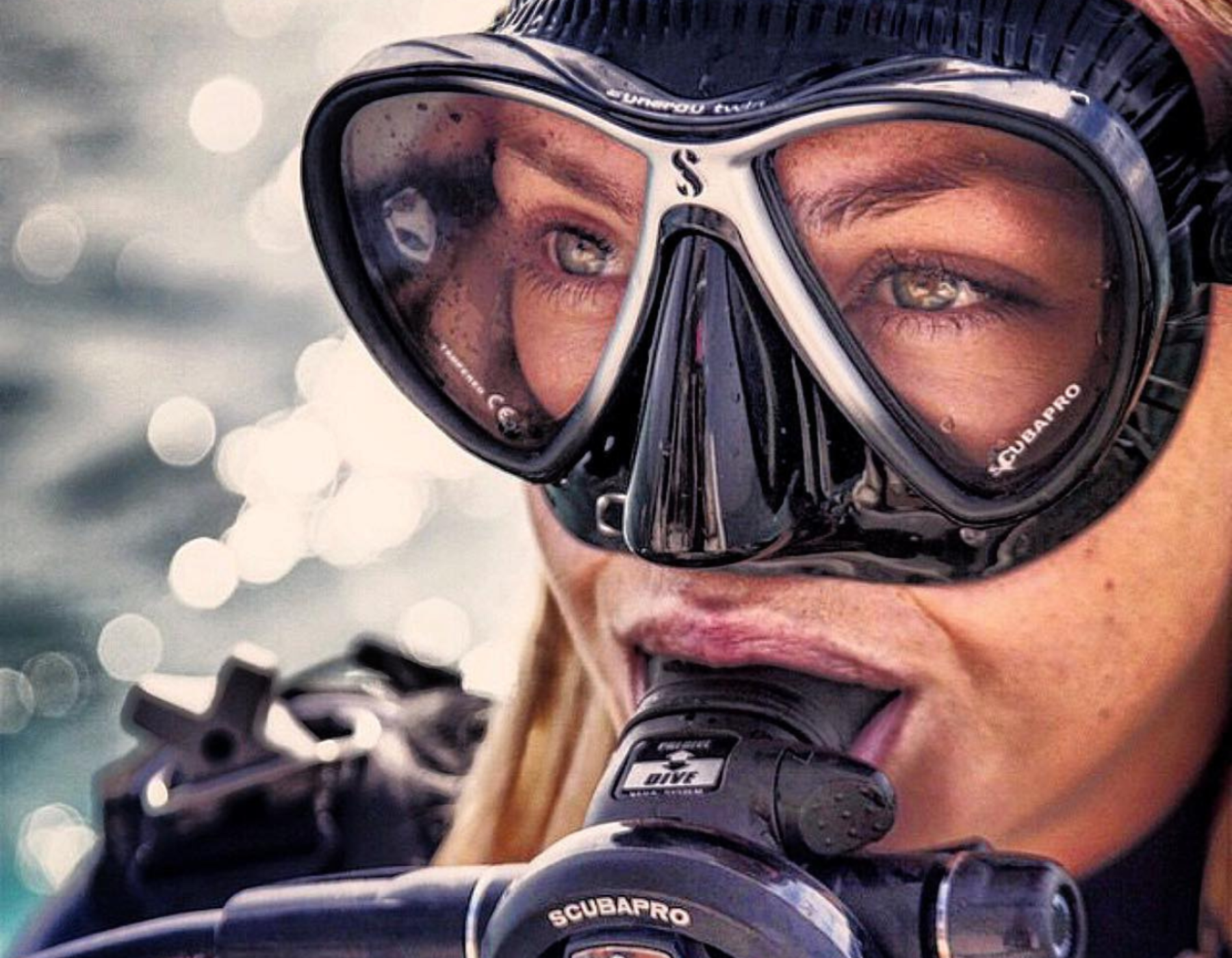 Lady looking happily thoughtful in scuba gear
