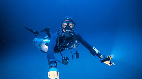 diver using a wrist mounted dive torch
