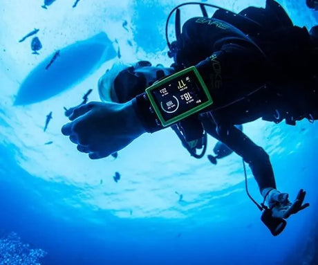 diver in water wearing suunto dive computer
