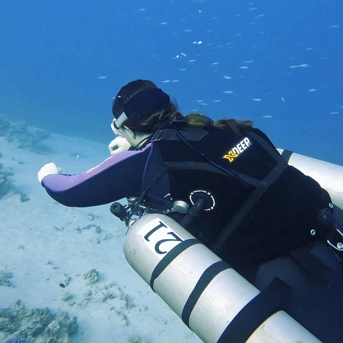 Woman Wearing XDeep BCD And 2 Side Canisters Scuba Diving
