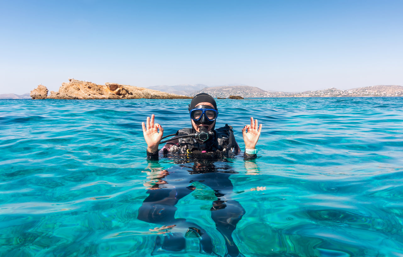 scuba diver giving the okay sign